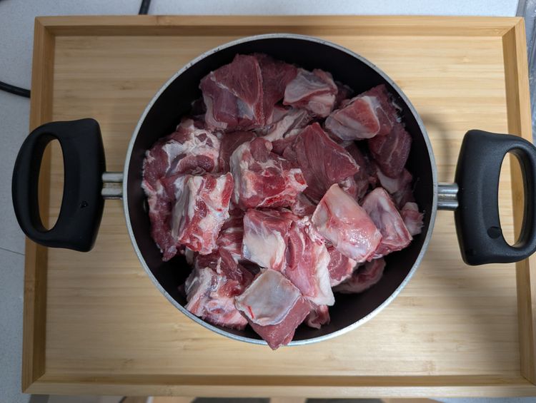 Step 1.1: Add meat to the warm oil along with ginger and garlic paste