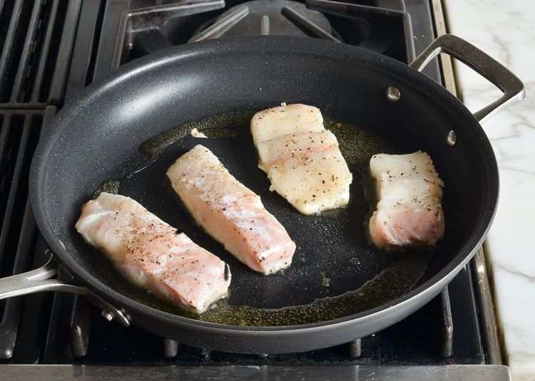 Step 2.1: Place the fish, presentation-side down, in the pan and cook without touching until golden brown and crisp, about 3 minutes