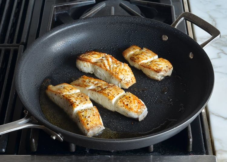 Step 2.1: Flip the fish and lower the heat to medium; continue cooking until the halibut is just firm to the touch and opaque when you pry open a thicker piece with a paring knife, 3 to 4 minutes