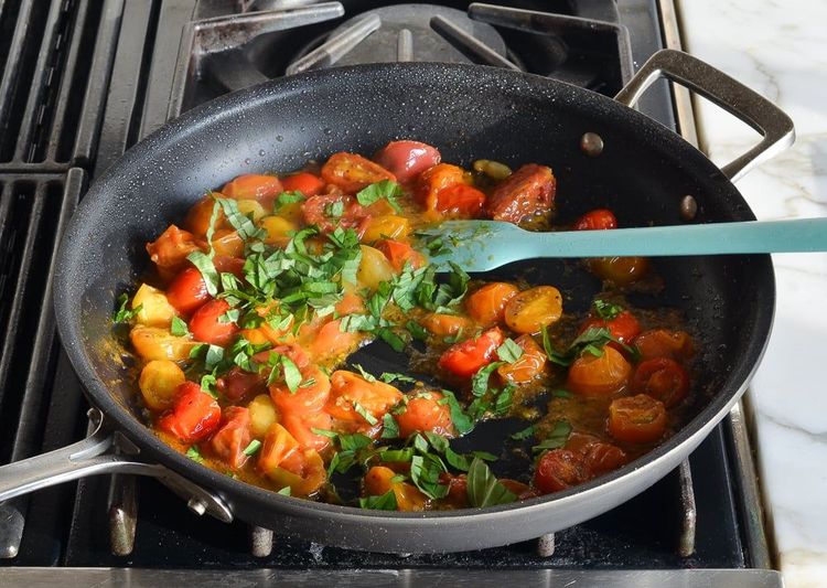 Step 3.1: Add the remaining 1 tablespoon oil to the pan, followed by the cherry tomato mixture