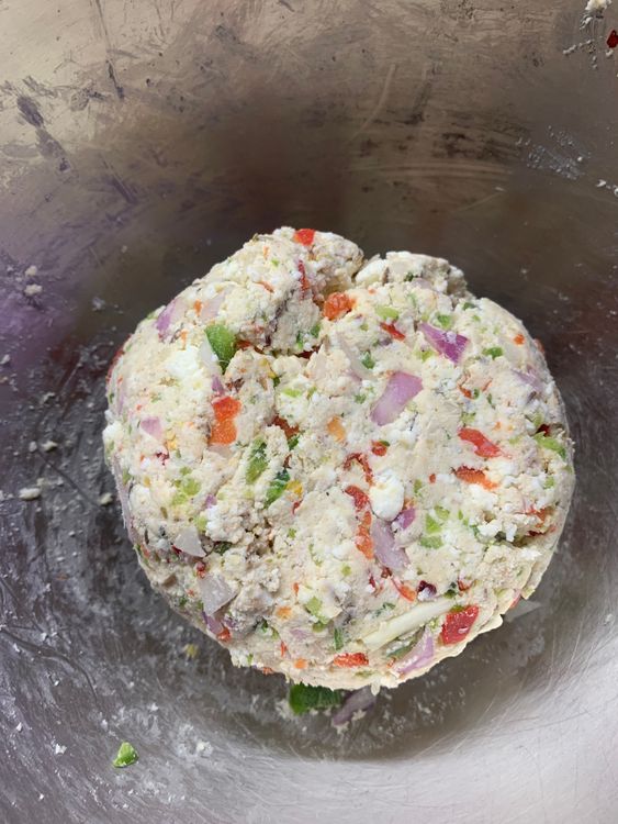 Step 1.1: In a mixing bowl, combine grated paneer, capsicum, carrot, onion, chilli flakes, oregano, chaat masala, dry mango powder, cumin seeds, coriander powder, salt and maida