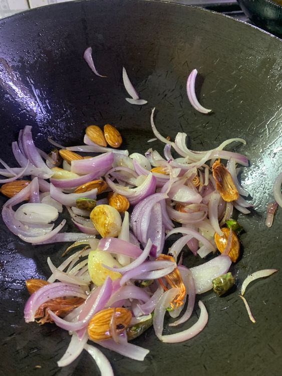 Step 2.1:  Add the sliced onion and almonds and stir for 3-4 minutes until the onions become translucent