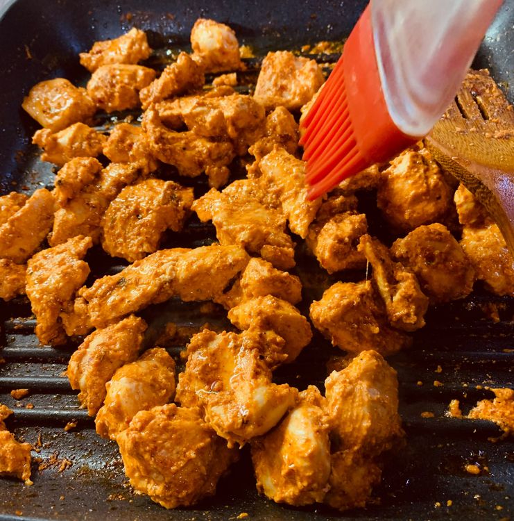 Step 1.2: Occasionally stir and brush the chicken with oil, at intervals, until fully cooked and golden