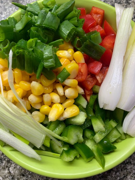 Step 1.1: Chop the capsicum and spring onions, and set them aside with corn kernels