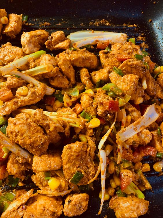 Step 1.2: Add the chopped vegetables and corn kernels, and stir-fry for 2-3 minutes