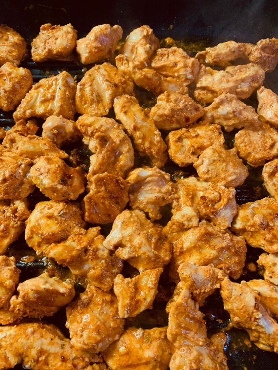 Step 1.1: Occasionally stir and brush the chicken with oil, at intervals, until fully cooked and golden