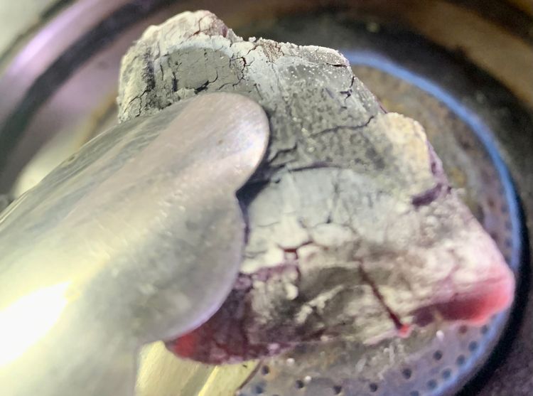 Step 1.1: Burn a small piece of charcoal till red hot
