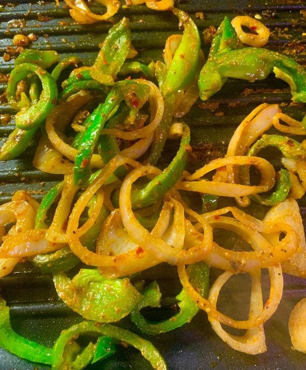 Step 1.1: Add the capsicum and toss them together for 3-4 minutes