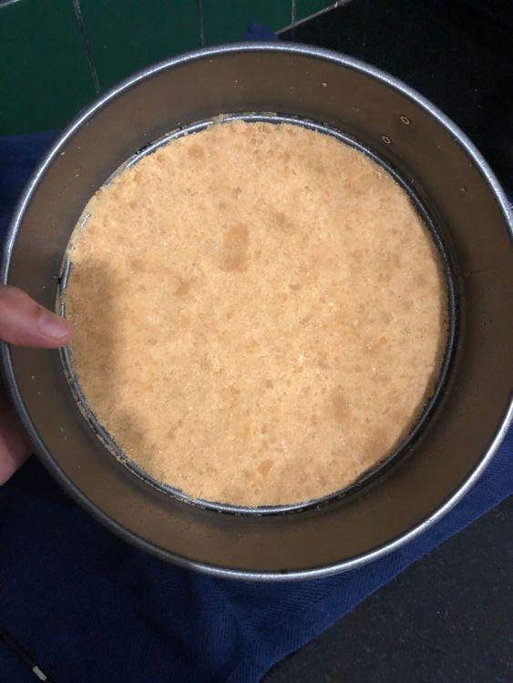 Step 2.1: Crush the digestive biscuits and mix with melted butter