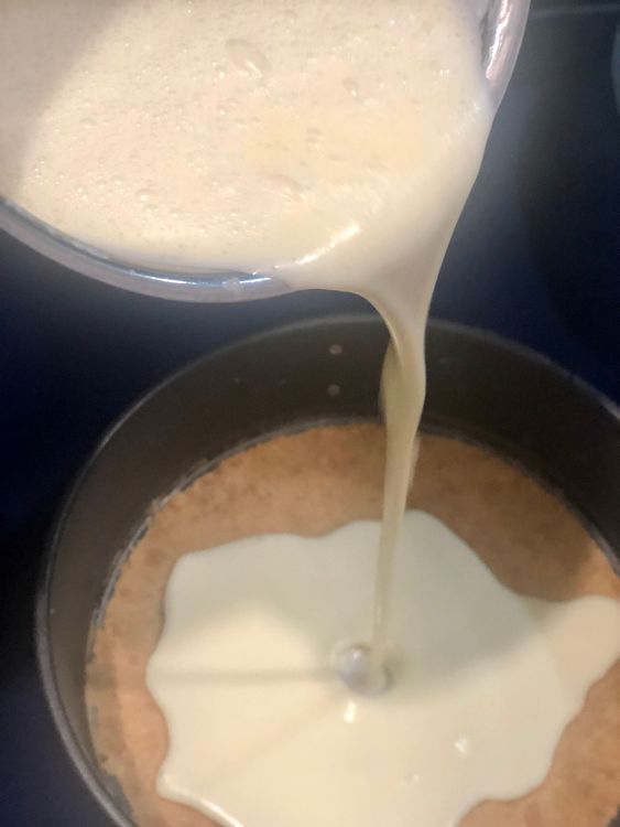 Step 3.1: Pour the batter over the prepared biscuit base in the greased or lined Springform pan