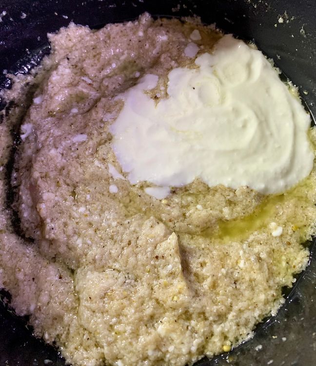 Step 4.1: Reduce the flame from low to medium and add whisked curd to the pot