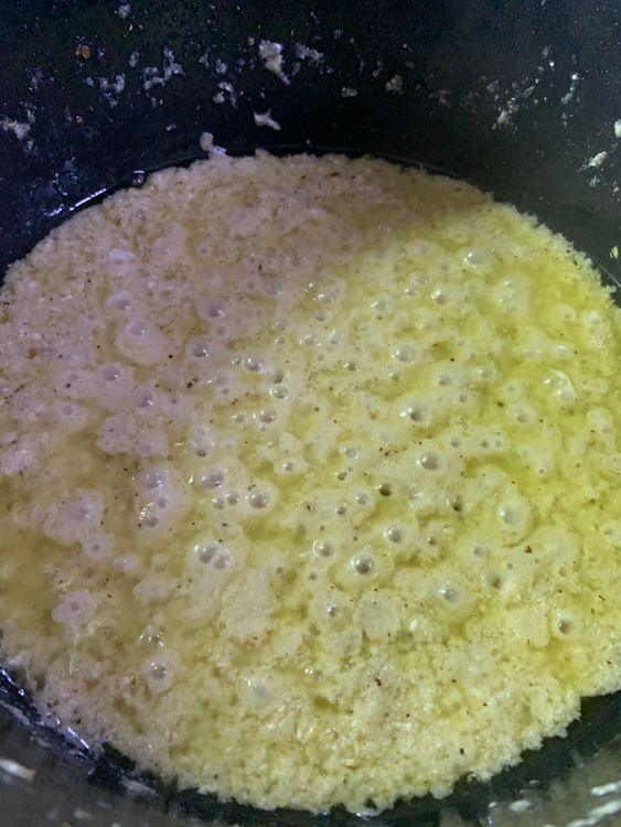 Step 4.2: Reduce the flame from low to medium and add whisked curd to the pot