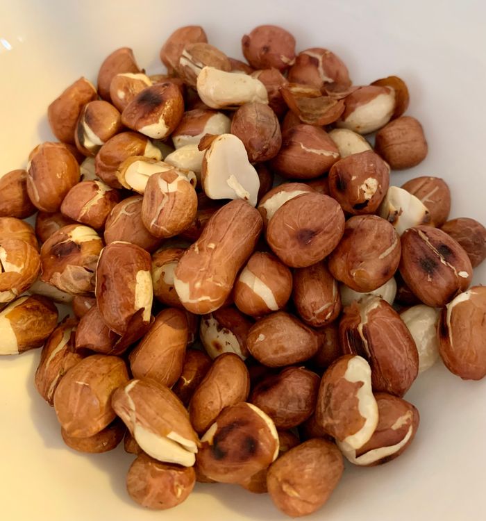 Step 2.1: Dry roast raw peanuts for 2 minutes on medium to high flame in a non-stick pan and keep them aside for later use