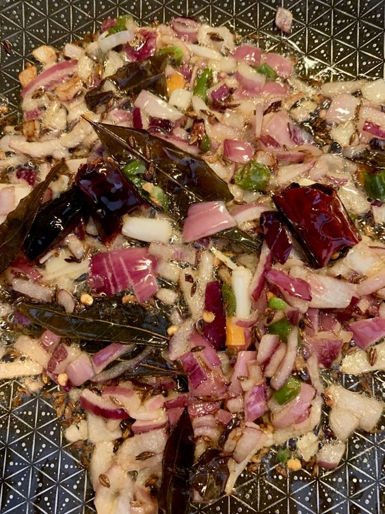 Step 2.1: Add the chopped onions and green chillies
