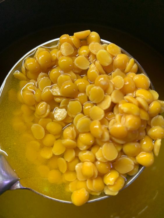 Step 2.1: Rinse dal in water 2-3 times and add it to a pressure cooker