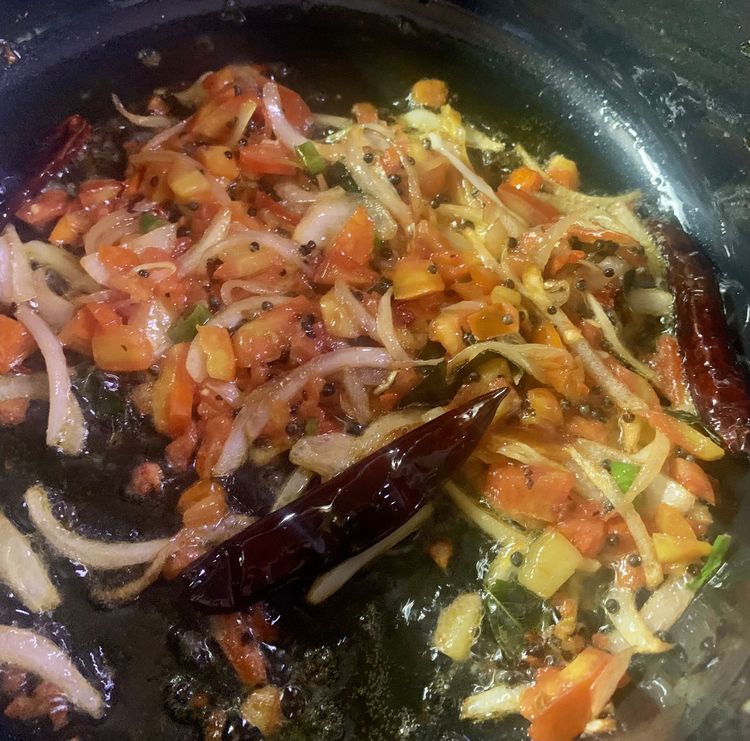 Step 3.1: Add the diced tomatoes and green chilli and mix