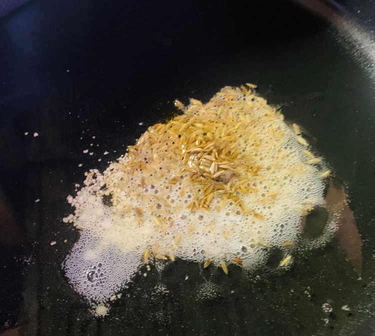 Step 3.1: Heat ghee in a heavy-bottomed deep wok or the cooker on medium heat
