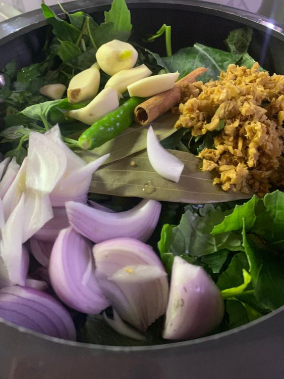 Step 2.1: Add all the leaves along with stems to  the pressure cooker