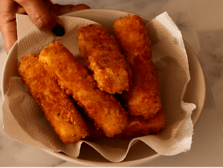 Step 4.1: Once fried, transfer the paneer fingers to a plate lined with paper towels to drain excess oil