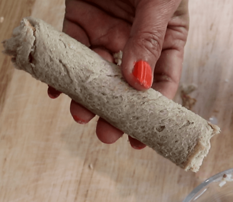 Step 3.2: Gently roll the bread slice around the filling, forming a tight roll