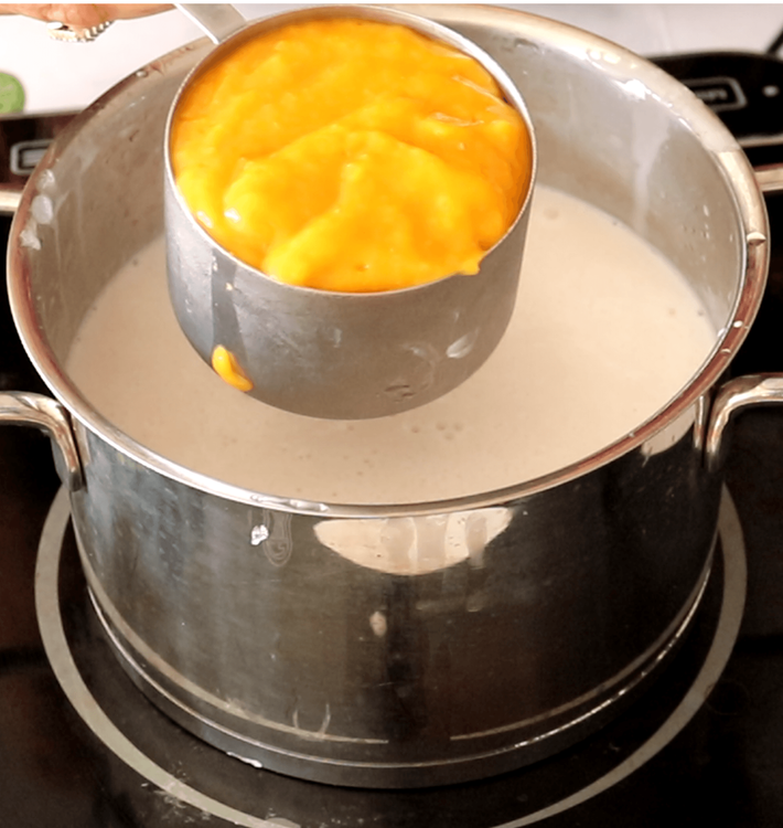 Step 1.1: Mix in the mango puree, ensuring the mixture is smooth and lump-free