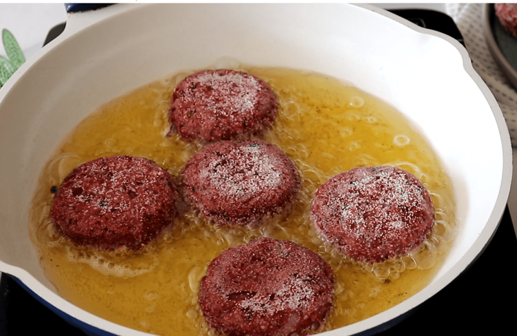 Step 3.1: Gently slide the cutlets into the hot oil