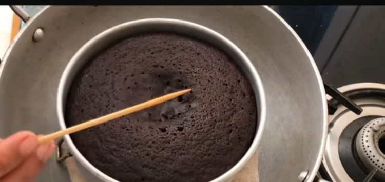 Step 1.1: Divide the batter evenly between the prepared pans and smooth the tops