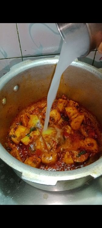 Step 1.2: Once the potatoes are well coated, add 1 cup of water, add 1 tsp sugar let it simmer for few minutes