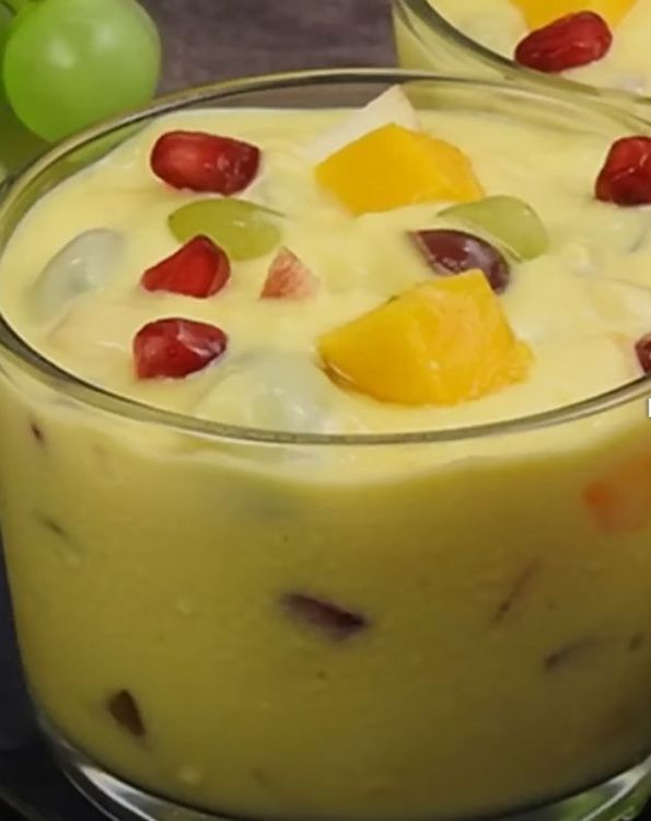 Step 2.1: In individual bowls, add the chopped fruits and pour the cooled custard over them