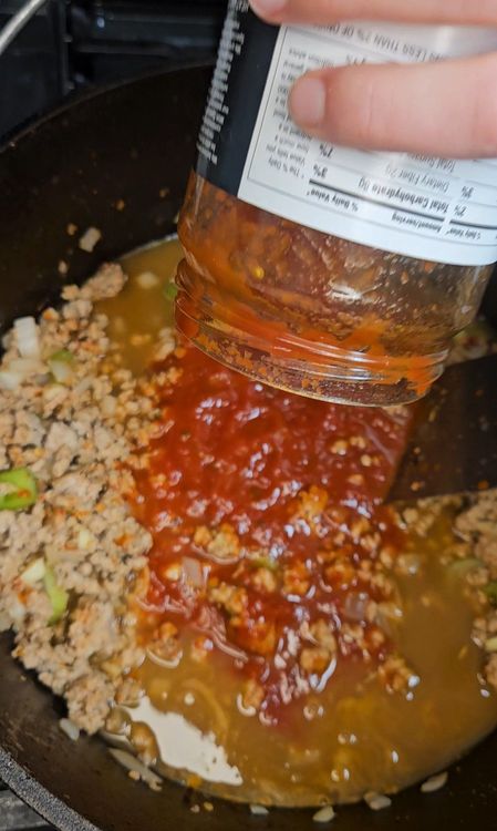 Step 3.1: Stir in the broth, marinara sauce, and bay leaf