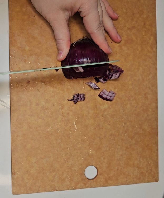 Step 1.1: Finely dice the red onion and mince the garlic
