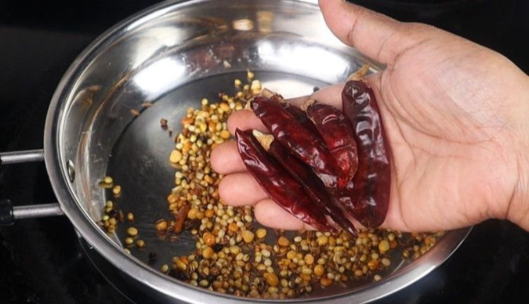 Step 1.10: Add chana dal, urad dal, coriander seeds, cumin seeds, methi, black pepper, and dried red chilies