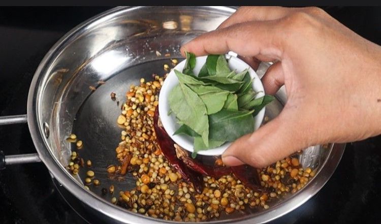 Step 1.1: Add curry leaves and grated coconut