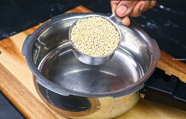 Step 1.1: Take 1/2 cup of urad dal, rinse well, and pressure cook it with sufficient water for 3-4 whistles or until soft and mushy