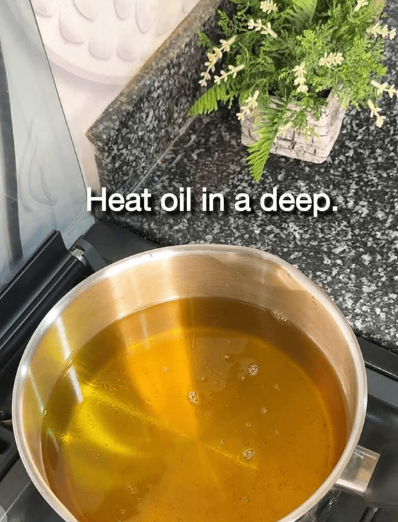 Step 1.3: Heat oil in a deep pan