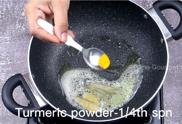 Step 4.3: In the same pan, add butter, bay leaf, turmeric powder, Kashmiri chilli powder, salt, and the prepared kadai masala powder