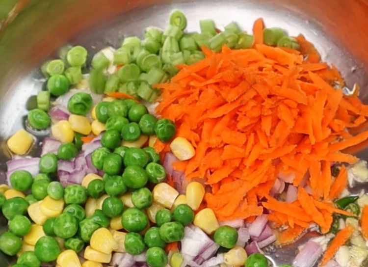 Step 2.4: Add finely chopped onion, carrot, sweet corn, green peas, and chopped beans