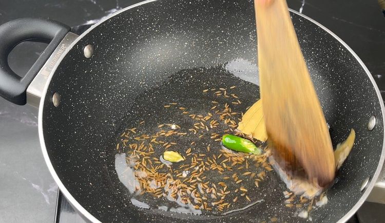 Step 2.1: Sauté for a few seconds until the whole spices release aroma