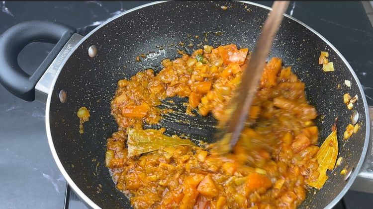 Step 3.1: Cook until the tomatoes turn mushy and mash them slightly with a spatula