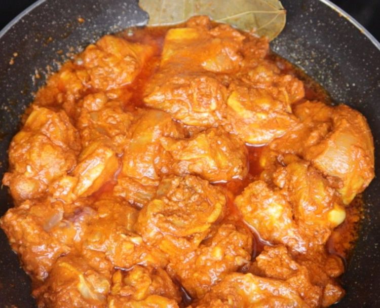 Step 3.1: Add the marinated chicken and sauté on medium flame until the chicken starts releasing water and cooks halfway