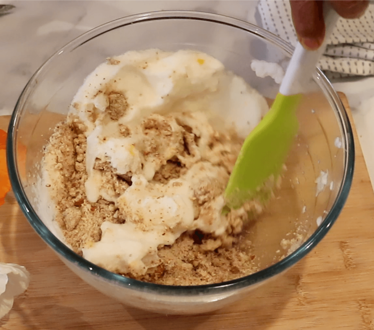 Step 1.2: Add the lemon zest to the bowl and gradually fold the almond-sugar mixture into the whisked egg white, gently combining with a spatula to form a dough