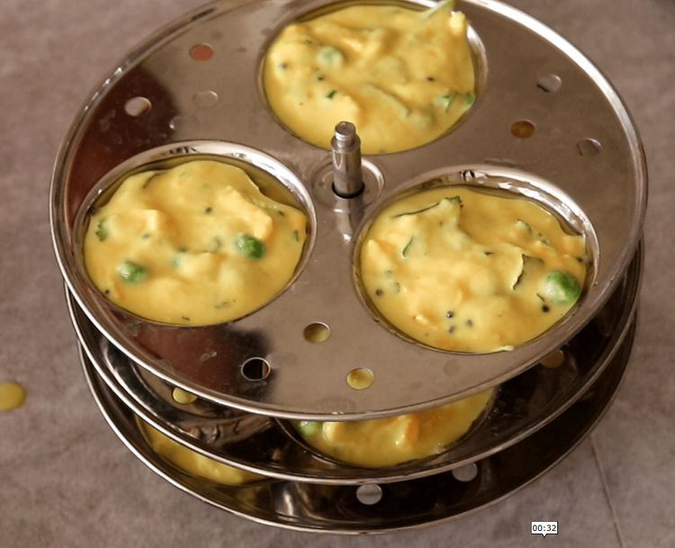 Step 4.1: Pour the prepared batter into the moulds, filling each cavity about three-quarters full