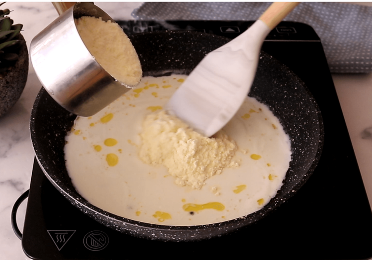 Step 1.1: Gradually add the milk powder, stirring continuously to avoid lumps