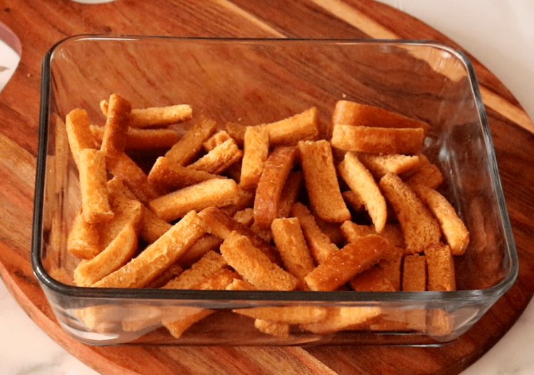 Step 1.1: Arrange the fried bread pieces in layers on a flat serving dish and set aside