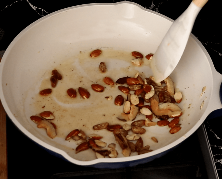 Step 1.1: Add almonds, raisins, and sliced dried coconut