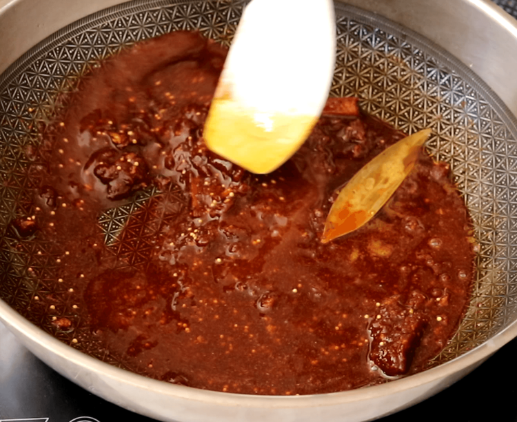 Step 4.1: Mix in red chilli powder, Kashmiri chilli powder, rai, yellow mustard seeds, kalonji, black salt, and regular salt