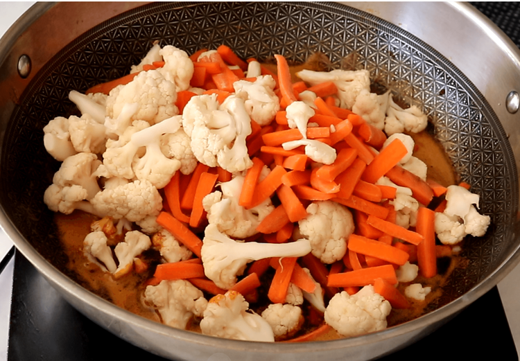 Step 5.1: Add the sun-dried carrots and cauliflower to the pan