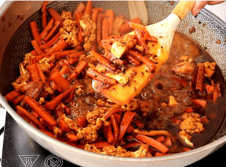 Step 5.2: Cook for about 8–10 minutes until the syrup slightly thickens