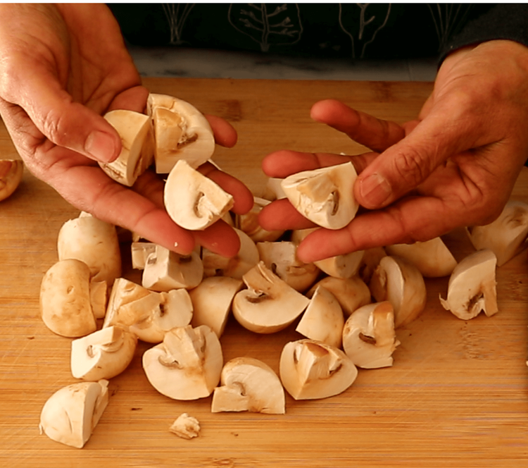 Step 1.2: Rinse the mushrooms thoroughly, pat them dry, and cut them into halves or quarters, depending on their size