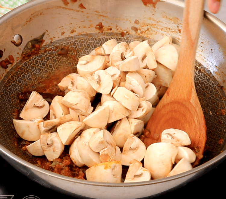 Step 1.1: Add the mushrooms along with coarsely ground black pepper, the remaining curry leaves, lemon juice, and salt